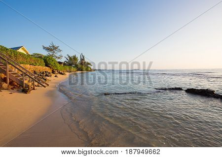 Tropical paradise at Bathtub Beach in Laie Oahu Hawaii with the Pacific Ocean and the sandy beach.