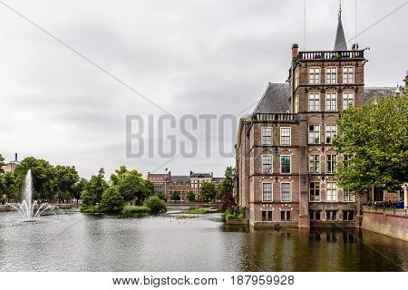 Hague Netherlands - August 7 2016: Hofvijver Court Pond artificial lake beside the Binnenhof. Binnenhof is a complex of buildings in the city centre of The Hague. Office of the Prime Minister and House of Representatives.