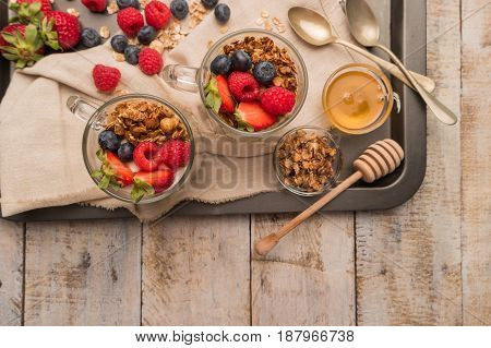 Breakfast parfait with homemade granola fresh fruits and yogurt