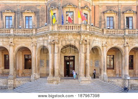 The facade and recessed loggia of Palazzo Ducezio the Town Hall (Municipio) nowadays - Noto Sicily Italy, 18 October 2011
