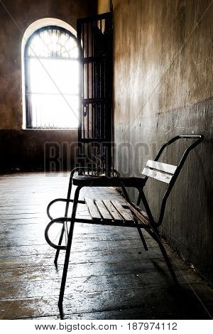 wooden chair in grungy interior. Loneliness estrangement alienation concept.