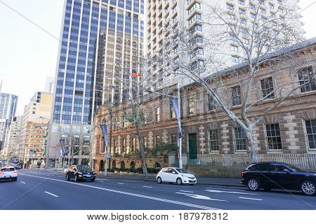 car on the road along vintage building taken in Sydney Australia on 8 July 2016