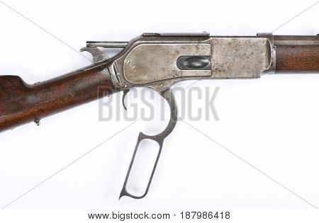 Antique 1876 Cowboy lever action rifle in cocked hammer position.