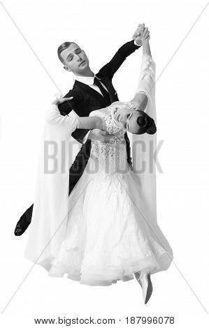 ballroom dance couple in a dance pose isolated on white background. sensual professional dancers dancing walz tango slowfox and quickstep. Black and white