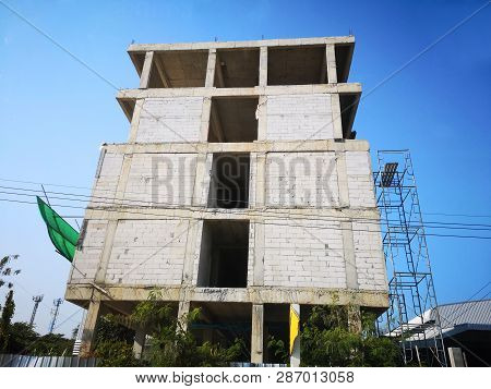 Construction Site Of Building 5 Storeyed , Multi-storey, And Scaffolding