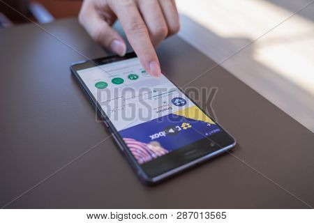 Chiang Mai, Thailand - May 06,2018: Man Using Huawei With Dropbox On Screen. Dropbox Is A Service Th