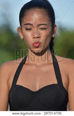 Youthful Diverse Female Winking