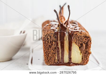 Chocolate Pear Cake On A White Board, White Background. Fruitcake With Chocolate.