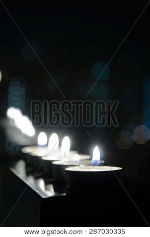 Fire Of Festive Candles On The Black