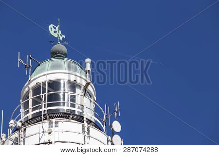 Lighthouse In Schevenigen, The Hague Beatch Against A Pur And Blue Sky At Summer Time