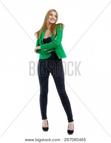 Full body, happy blonde model in jeans and green jacket, isolated on white background