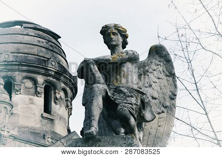 Angel Of Death With A Book Of Life Against The Background Of The Ruins Of An Old Church (azrael, Azr