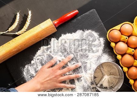 Food Preparation Concept Over Head Shot Kneading Dough For Bakery, Pizza Or Pasta On Black Backgroun