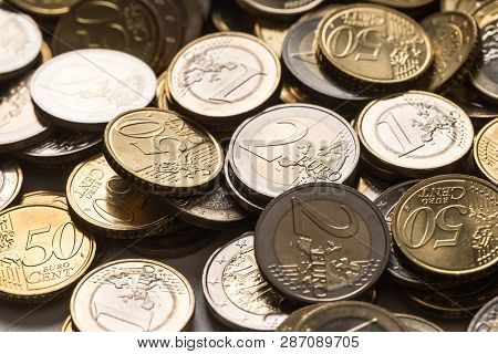 Close-up A Pile Of New Euro Coins In Other Compositions
