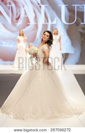 ZAGREB, CROATIA - FEBRUARY 02, 2019: Croatian singer Romana Pavlisa in a wedding dress walking down the runway at the Wedding fair