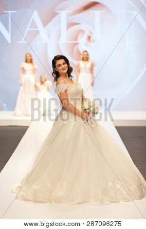 ZAGREB, CROATIA - FEBRUARY 02, 2019: Croatian singer Romana Pavlisa in a wedding dress walking down the runway at the Wedding fair
