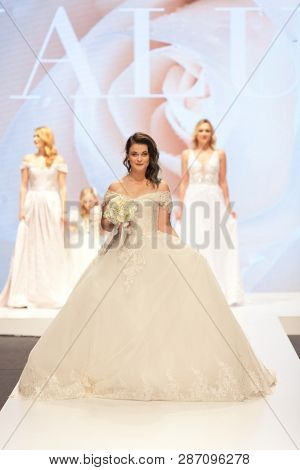 ZAGREB, CROATIA - FEBRUARY 02, 2019: Croatian singer Romana Pavlisa in a wedding dress walking down the runway at the Wedding fair