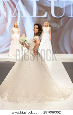 ZAGREB, CROATIA - FEBRUARY 02, 2019: Croatian singer Romana Pavlisa in a wedding dress walking down the runway at the Wedding fair