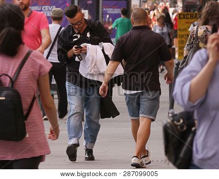 Bucharest, Romania - July 17, 2018: Romanian Fashion Designer Razvan Ciobanu Looks On The Phone Whil
