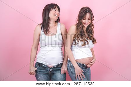 Maternity Concept, Two Pregnant Women With An Open Tummy