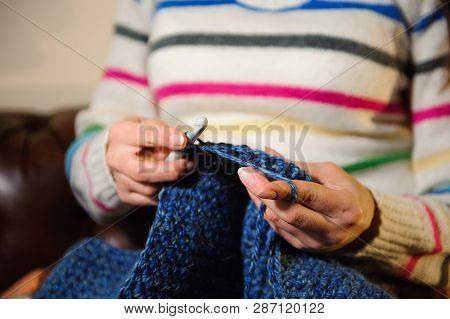 Womens Hands Knitting. Close Up Of Hands Knitting. Process Of Knitting