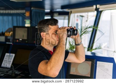 Officer During Navigational Watch Looking Through Binoculars