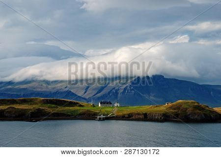 Beauty Of Wild Nature. Mountain Coast And Sea Under Cloudy Sky In Rejkjavik, Iceland. Mountain Lands