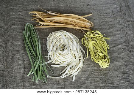 Colorful Raw Italian Pasta On A Jute Fabric. Colors