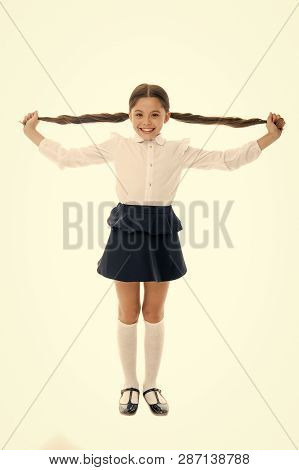Happy Kid Show Long Brunette Hair Isolated On White. Fashion Girl Smile With New Hairstyle. Proud Of