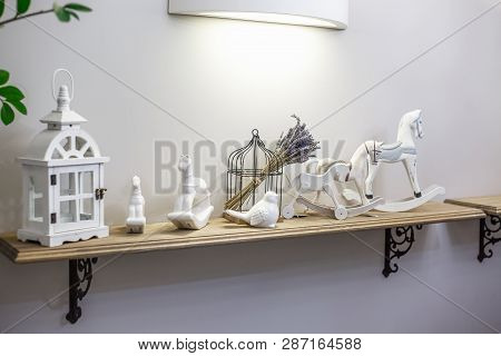 Interior Decoration Toys. White Decorative Wooden Latern Lights And Ceramic Horses In Expensive Inte