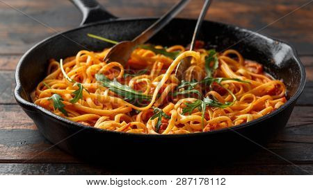 Spaghetti Alla Amatriciana With Pancetta Bacon, Tomatoes And Pecorino Cheese. Served In Cast Iron Sk