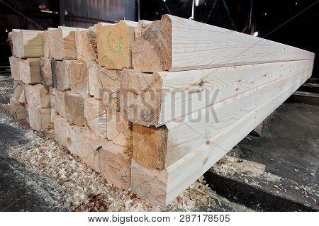 Wood At The Sawmill. Lumber Is Stored In The Warehouse.