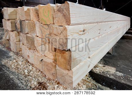 Wood At The Sawmill. Lumber Is Stored In The Warehouse.