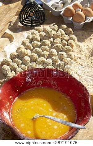 Stuffed Ascolana Olives Immersed In The Egg During The Preparation