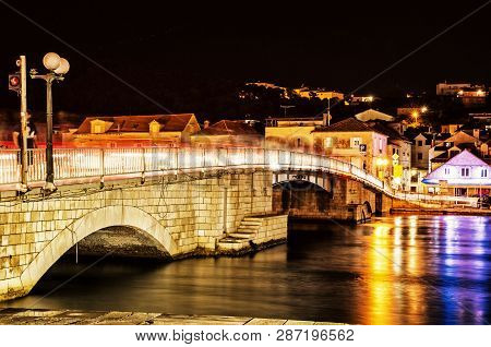 Bridge From Trogir To Ciovo Island, Croatia. Night Scene. Travel Destination. Yellow Photo Filter.