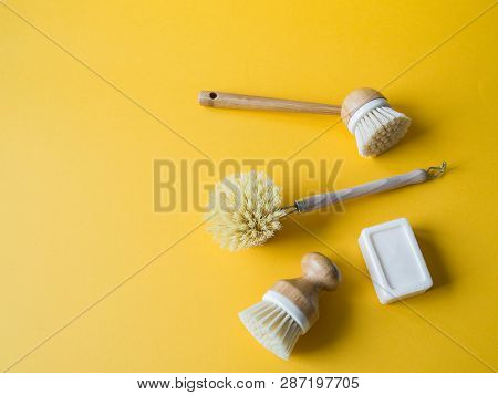Dish Washing Brushes On Yellow Background. Sustainable Lifestyle Zero Waste Concept. Clean Without W