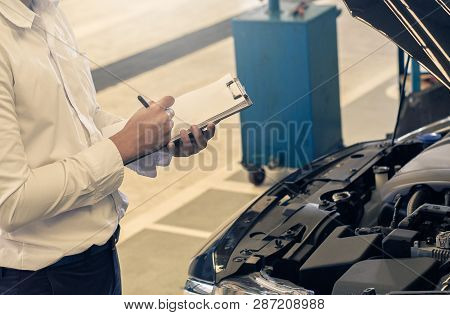 This Career Man Saleman Business Inspection Writing Note On Notepad Or Book, Paper With Car Blurry B