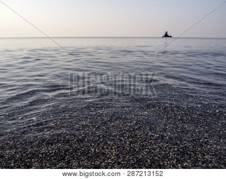 Waves And Beautiful Sunset On The Greek Island Evia (euboea) In The Aegean Sea