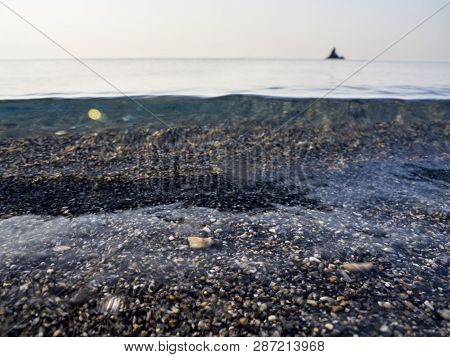 Waves And Beautiful Sunset On The Greek Island Evia (euboea) In The Aegean Sea