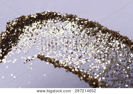 A Golden Nail Gritter For Manicure. Yellow Tone Glitter Shining On Daylight. Stock Photo Isolated On
