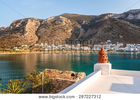 The Bay Of Sifnos With A Long And Sandy Beach And Crystal Water Surrounded By Beautiful Mountains. S