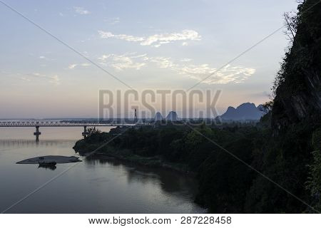 Wide Angle Picture Of Bat Cave And Thanlwin Bridge Over The River, Located In Hpa-an, Myanmar.