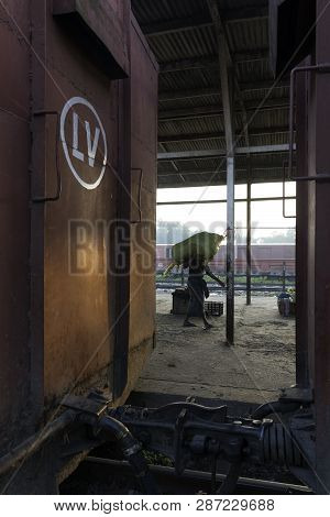 Thazi, Myanmar - 23 November, 2018: Vertical Picture Of Burmese People Working At Thazi Train Statio