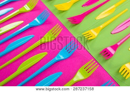 Many Color Plastic Cutlers On A Bright Background