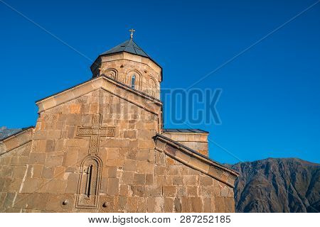 Gergeti Trinity Church In The Mountains Of The Caucasus, Geogria