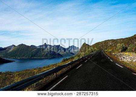 Road Trough The Mountain And Fjord Ladnscape Of Senja