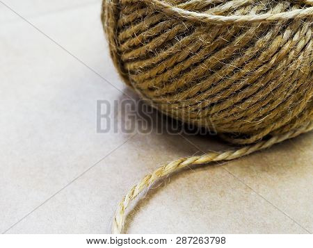 Natural Jute Twine Roll, Top View On White Wood Background. Diy Wrap Gift Hemp Rope Cord String Roll