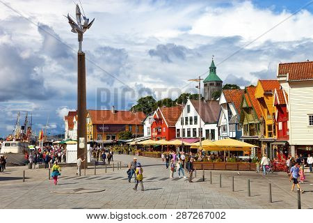 Stavanger, Norway - August 04, 2017: People At The Quay Port With Many Restaurants And Pubs In The C