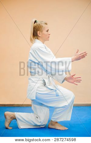 Young Girl Dressed In Hakama Practicing Aikido.