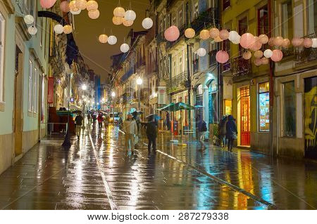Porto, Portugal - November 21, 2016: Raining Evening At Santa Catarina Street, Paper Lanterns Decora